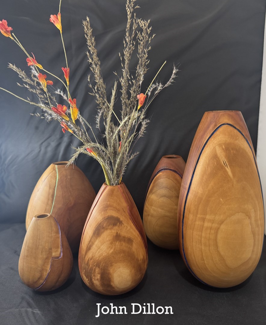Grouping of tall turned vessels from the October 2025 Chicago Woodturners newsletter gallery